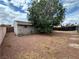 Backyard with a large tree, providing shade and a natural focal point to the outdoor space at 1004 Stone River Dr, North Las Vegas, NV 89030