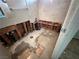 Bathroom with exposed plumbing, tiled walls, and an opportunity for renovation at 1004 Stone River Dr, North Las Vegas, NV 89030