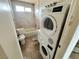 Bathroom features toilet, tub and stacked washer/dryer, needs improvements at 1004 Stone River Dr, North Las Vegas, NV 89030