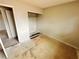Empty bedroom with closet; in need of repair and renovation to restore to original condition at 1004 Stone River Dr, North Las Vegas, NV 89030