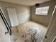 Bedroom showing a window and signs of needed repair, presenting renovation possibilities for buyers at 1004 Stone River Dr, North Las Vegas, NV 89030