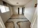 Bedroom featuring damage to the flooring, a closet, and natural light from the window at 1004 Stone River Dr, North Las Vegas, NV 89030