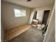 Bedroom showcasing a window, closet, and signs of needed repair, offering renovation potential at 1004 Stone River Dr, North Las Vegas, NV 89030