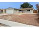 Charming home with a two-car garage and minimal landscaping, perfect for easy maintenance and care at 1004 Stone River Dr, North Las Vegas, NV 89030