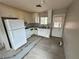 Functional kitchen featuring white appliances and plenty of cabinet space at 1004 Stone River Dr, North Las Vegas, NV 89030