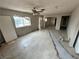 Bright living room with tile flooring and large windows for ample sunlight at 1004 Stone River Dr, North Las Vegas, NV 89030