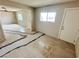 Living room needs TLC: damaged floors, neutral walls, and natural light at 1004 Stone River Dr, North Las Vegas, NV 89030