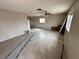 Spacious living room with tile flooring, ceiling fan, and good natural light at 1004 Stone River Dr, North Las Vegas, NV 89030