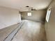Spacious living room featuring tile flooring and a ceiling fan at 1004 Stone River Dr, North Las Vegas, NV 89030