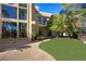 Expansive backyard featuring a well-maintained lawn and mature shade trees for relaxation at 1008 Trophy Hills Dr, Las Vegas, NV 89134