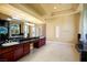 Large bathroom with dual sinks, tile floor, lots of natural light and a soaking tub at 1008 Trophy Hills Dr, Las Vegas, NV 89134