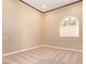 Cozy bedroom with neutral walls, carpet, and a bright window at 1008 Trophy Hills Dr, Las Vegas, NV 89134