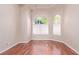Bonus room offering natural light from arched windows and showcasing hardwood flooring at 1008 Trophy Hills Dr, Las Vegas, NV 89134