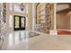 Grand foyer with soaring ceilings, custom stone accents, and decorative lighting at 1008 Trophy Hills Dr, Las Vegas, NV 89134