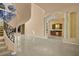 Bright foyer area with spiral staircase, columns, and a wet bar area at 1008 Trophy Hills Dr, Las Vegas, NV 89134
