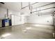 Spacious three car garage featuring epoxy floors and custom storage cabinets at 1008 Trophy Hills Dr, Las Vegas, NV 89134