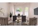 Home office featuring large desk, comfortable seating, arched windows providing natural light at 1008 Trophy Hills Dr, Las Vegas, NV 89134