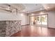 Spacious living room with hardwood floors, recessed lighting, and a stone bar at 1008 Trophy Hills Dr, Las Vegas, NV 89134