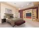 Comfortable bedroom featuring a bed and an entertainment center with a TV at 1008 Trophy Hills Dr, Las Vegas, NV 89134