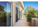 View of a spacious patio with trees, sliding glass doors and railing at 1008 Trophy Hills Dr, Las Vegas, NV 89134