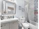 Updated bathroom with a modern vanity, stylish mirror, and tiled shower-tub combination at 10113 Walhalla Plateau Ct, Las Vegas, NV 89148