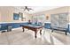 Bright game room with a pool table and a sliding glass door to the outside at 10113 Walhalla Plateau Ct, Las Vegas, NV 89148