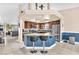 Spacious eat-in kitchen featuring a breakfast bar, wood cabinets, modern appliances and tiled floors at 10113 Walhalla Plateau Ct, Las Vegas, NV 89148