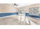 Bright and airy living room with plenty of natural light from the sliding glass door at 10113 Walhalla Plateau Ct, Las Vegas, NV 89148