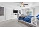 A large bedroom with carpet and a ceiling fan at 10113 Walhalla Plateau Ct, Las Vegas, NV 89148