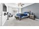 A spacious main bedroom with a walk-out to the backyard and comfortable seating at 10113 Walhalla Plateau Ct, Las Vegas, NV 89148