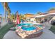 Beautiful backyard featuring a pool, spa, covered patio, and comfortable outdoor seating at 10113 Walhalla Plateau Ct, Las Vegas, NV 89148