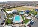 Aerial view of the community amenities including pool, splash pad, playground, clubhouse, and sports fields at 10196 Sequoia Glen Ave, Las Vegas, NV 89166