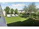 Lush backyard with artificial grass, lounge chairs, and privacy landscaping creates a serene outdoor retreat at 10196 Sequoia Glen Ave, Las Vegas, NV 89166