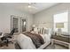 Bedroom features large bed, side table with lamp, and decor at 10196 Sequoia Glen Ave, Las Vegas, NV 89166