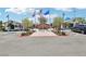 The community center showcases well-maintained landscaping, flags, and convenient parking at 10196 Sequoia Glen Ave, Las Vegas, NV 89166