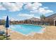 A refreshing community pool with lounge chairs, umbrellas, and a relaxing atmosphere for residents at 10196 Sequoia Glen Ave, Las Vegas, NV 89166