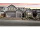 Beautiful two-story home featuring a brick driveway, three-car garage, modern design and well-manicured landscaping at 10196 Sequoia Glen Ave, Las Vegas, NV 89166