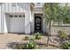 Inviting front entrance with a brick driveway, well-maintained landscaping, and charming front door at 10196 Sequoia Glen Ave, Las Vegas, NV 89166