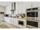 Bright kitchen features stainless steel appliances, white cabinetry, and a subway tile backsplash at 10196 Sequoia Glen Ave, Las Vegas, NV 89166