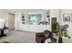 Stylish living room featuring carpet, built-in cabinets and shelves, plus a wine refrigerator at 10196 Sequoia Glen Ave, Las Vegas, NV 89166