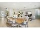 Open-concept living and dining area with light-colored walls, recessed lighting, and contemporary furnishings throughout at 10196 Sequoia Glen Ave, Las Vegas, NV 89166