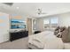 Comfortable primary bedroom with carpeting, windows, and a TV at 10196 Sequoia Glen Ave, Las Vegas, NV 89166