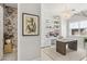 Stylish home office with custom shelving, an art piece and pendant lighting, complemented by an elegant desk area at 10196 Sequoia Glen Ave, Las Vegas, NV 89166