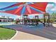 Community playground featuring multiple play structures with slides and covered shade for the hot summer at 10196 Sequoia Glen Ave, Las Vegas, NV 89166
