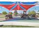 Community playground featuring multiple play structures with slides and covered shade for the hot summer at 10196 Sequoia Glen Ave, Las Vegas, NV 89166