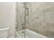 Modern bathroom with a clean, glass-enclosed shower and neutral tiling, complemented by a toilet on the left at 10196 Sequoia Glen Ave, Las Vegas, NV 89166