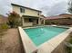 Beautiful backyard featuring a pool, covered patio, and thoughtfully designed landscaping for a private outdoor retreat at 10331 Northern Hills Ave, Las Vegas, NV 89166