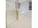 Bright bathroom featuring a glass-enclosed shower, soaking tub and brown wood window blinds at 10331 Northern Hills Ave, Las Vegas, NV 89166