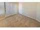 A carpeted bedroom with a closet and neutral wall color offers a cozy and inviting space at 10331 Northern Hills Ave, Las Vegas, NV 89166