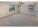 Large bedroom features two windows providing natural light, carpet flooring and a ceiling fan at 10331 Northern Hills Ave, Las Vegas, NV 89166